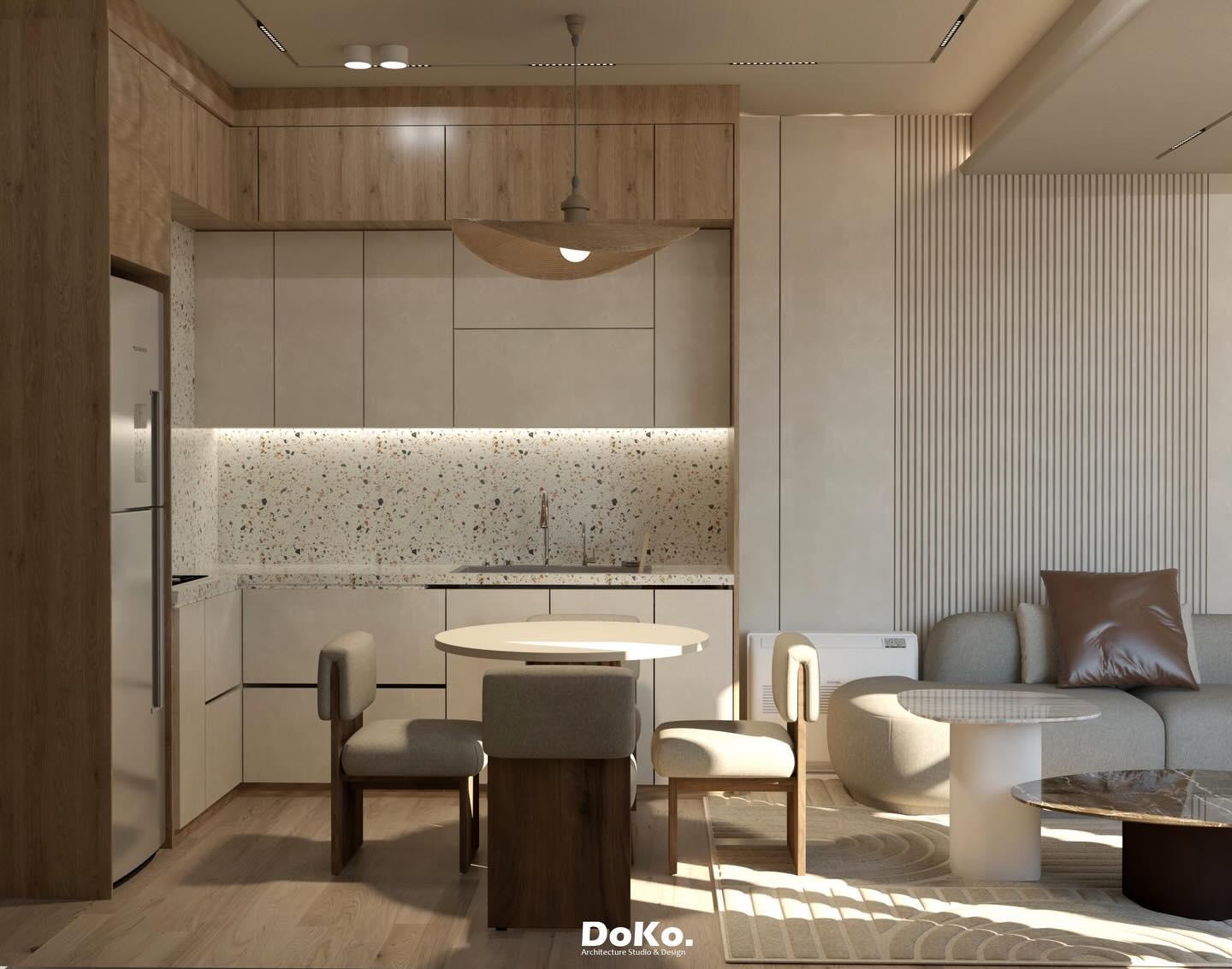 Render of the open-plan space: timber and white cabinetry, a terrazzo splashback, a round dining table and a lounge corner.