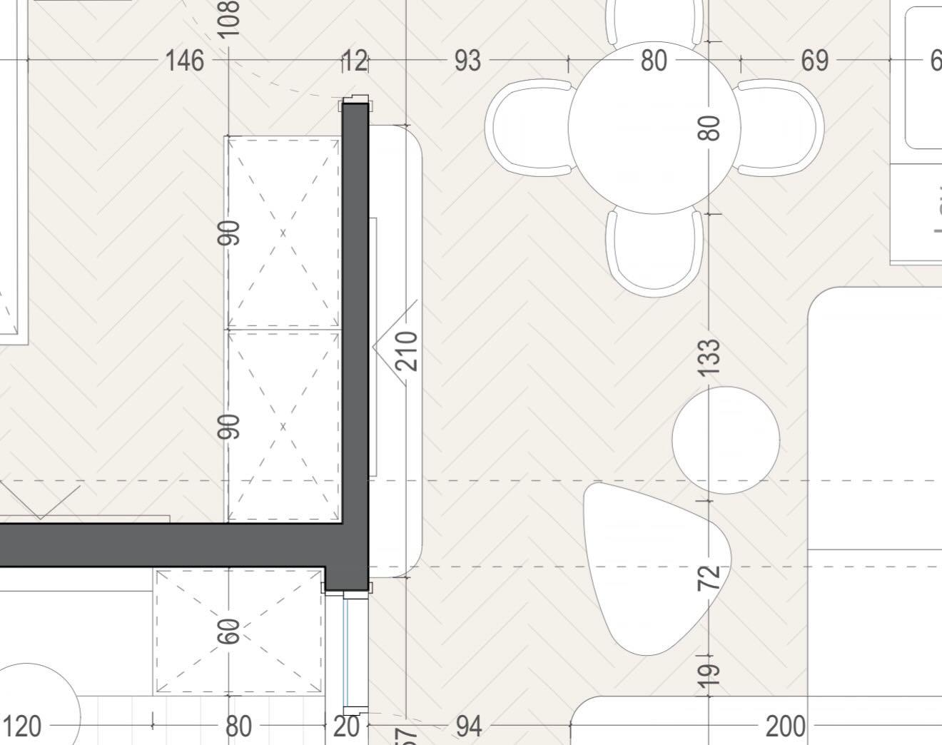 Dimensioned, furnished floor plan showing the dining table, sofa and kitchen layout.