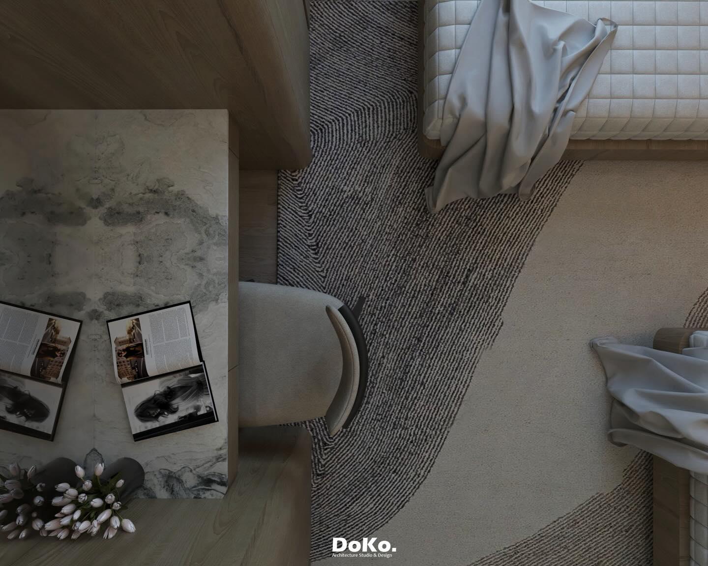 Overhead view of a bedroom corner with a chair, framed artwork and the mural wall.
